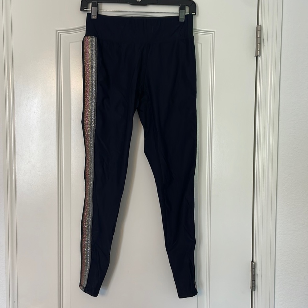 Black Terez leggings with metallic stripes down outside of leg. Size M.